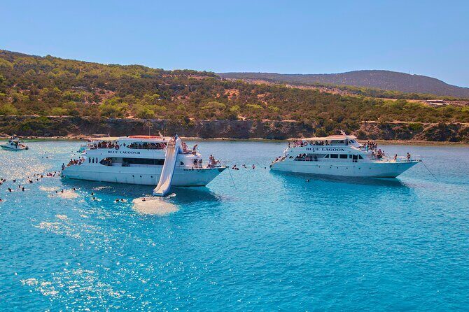 Blue Lagoon (Akamas) Bus & Boat Tour with Water Slide From Paphos - Onboard Life: Food, Drinks, and Crew Energy