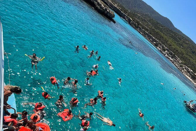 Blue Lagoon cruise: giant slide, music & Paphos hotel transfers - Manolis Bay and Fontana Amorosa: two scenic breaks for swimming views