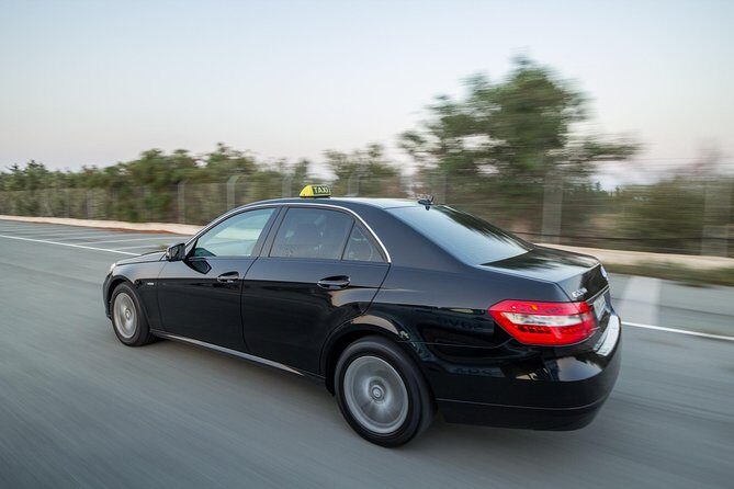 Private Transfer: Larnaca Airport to Protaras with return 1-14 pax - Finding your driver: the Flavours Cafe exit detail that matters